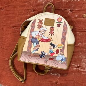 Pinocchio Disney Cream Loungefly mini backpack , RARE, like new